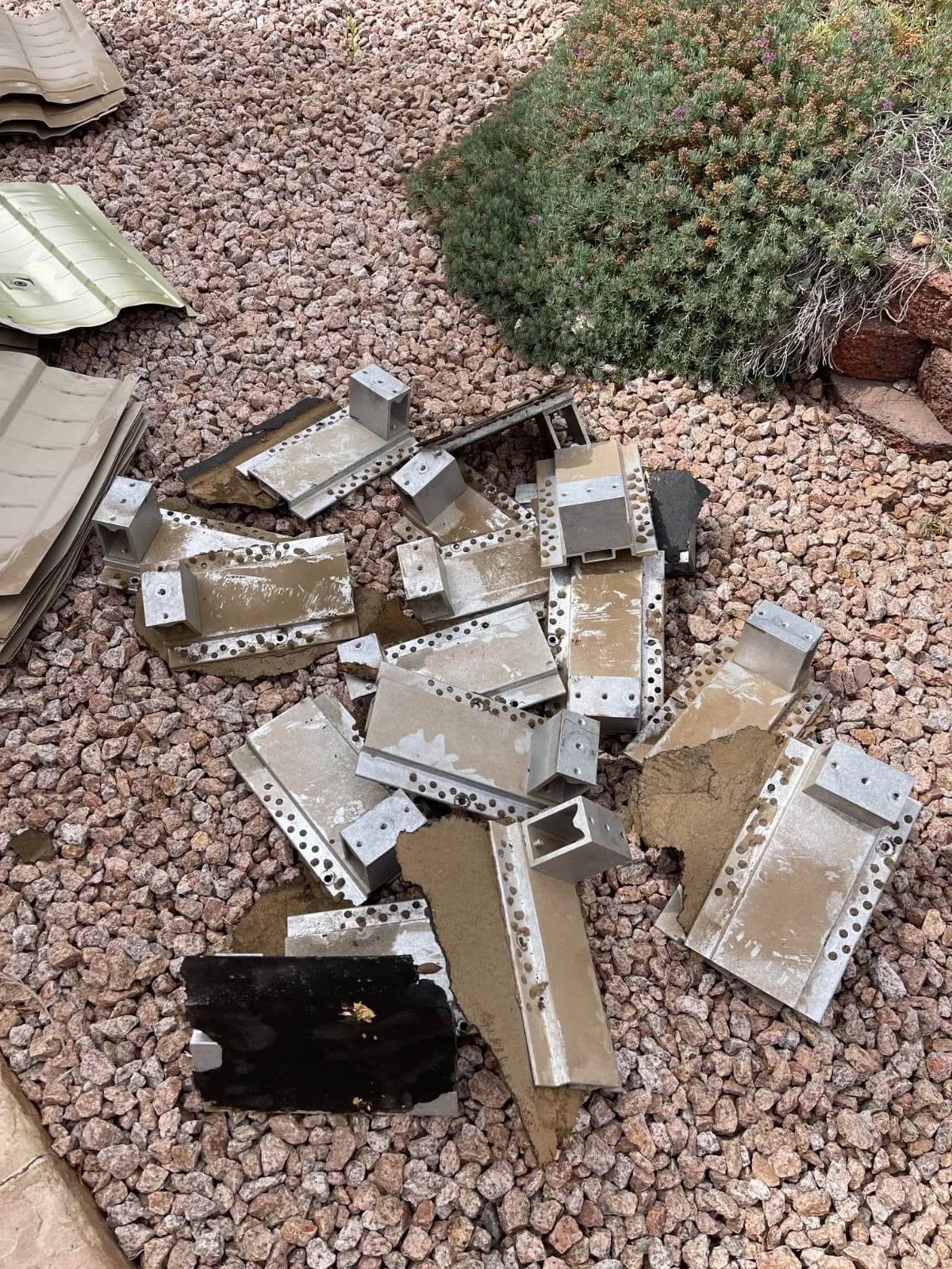 Aluminium mounting feet removed from a Phoenix roof during the solar detach